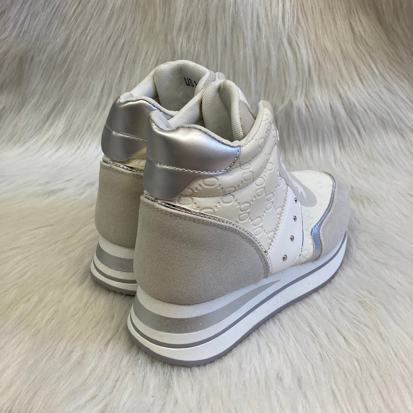 White wedge high-top trainer with pattern inspired