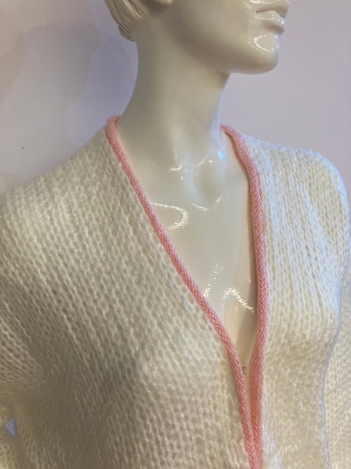 Fluffy white cardigan with pink outline