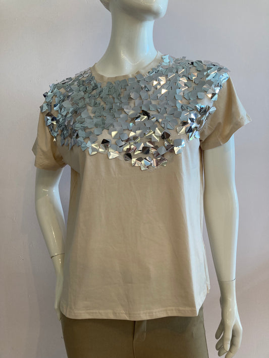 Beige top with large silver sequin on the front