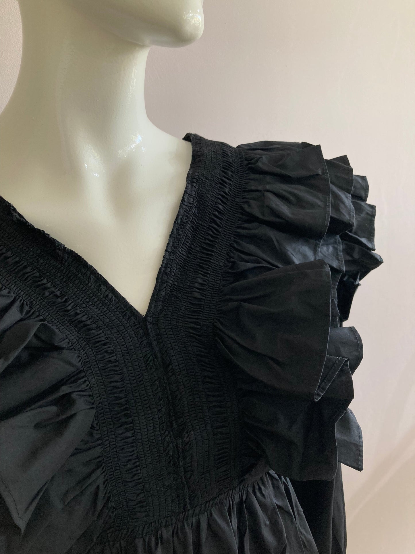 Black frilly blouse