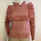Pink sweater with frill on the front and back