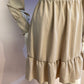 Beige skater dress with ruffle and knot at the neck