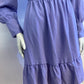 Lilac skater dress with ruffle and knot at the neck