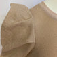 Shiny beige sweater dress with gathered sides