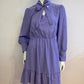 Lilac skater dress with ruffle and knot at the neck