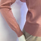 Pink sweater with frill on the front and back