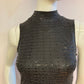 Black cocktail dress with sequins and sleeveless high neck.