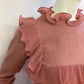 Pink sweater with frill on the front and back