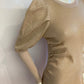Shiny beige sweater dress with gathered sides