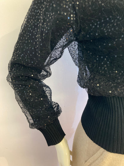 Small ribbed black sweater lined with sequin tulle