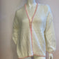 Fluffy white cardigan with pink outline