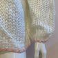Fluffy white cardigan with pink outline
