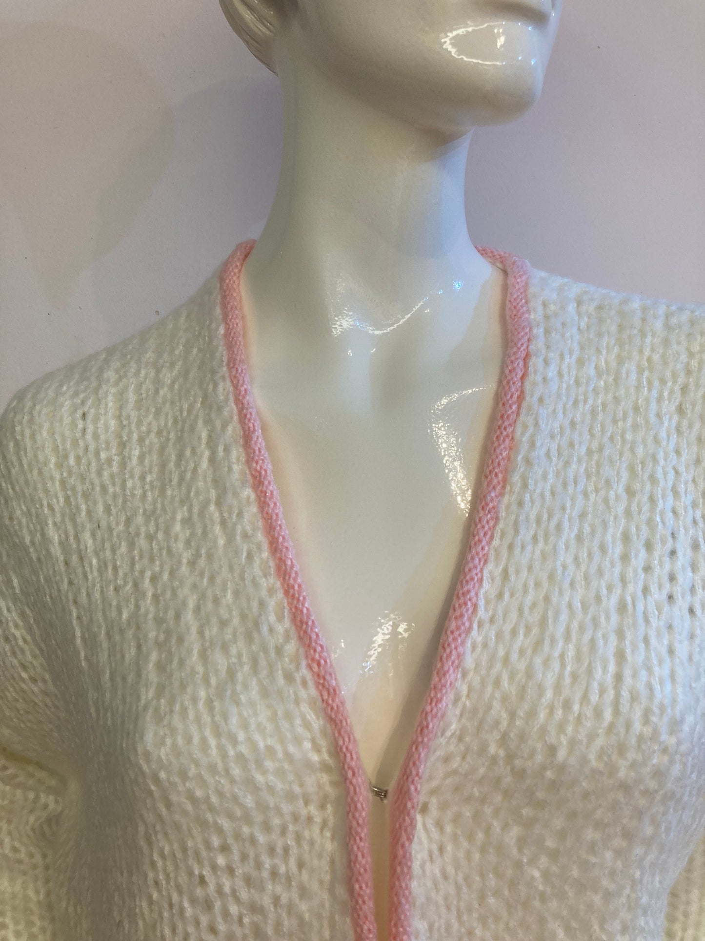 Fluffy white cardigan with pink outline