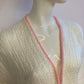 Fluffy white cardigan with pink outline