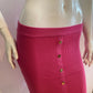 Fuchia ribbed knit buttoned at the front
