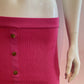 Fuchia ribbed knit buttoned at the front