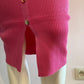 Fuchia ribbed knit buttoned at the front