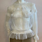 White blouse with plumetis tulle and ruffled
