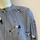 Blue striped blouse with bird motif