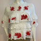 White top with ruffle and red embroidery