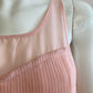 Pink blouse lined and pleated at the front