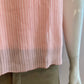 Pink blouse lined and pleated at the front