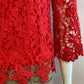 Red boat neck top in pretty lined lace