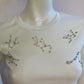 White t-shirt with rhinestones on the bust