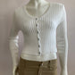 Nice short ribbed white cardigan with shiny buttons