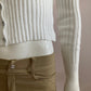 Nice short ribbed white cardigan with shiny buttons