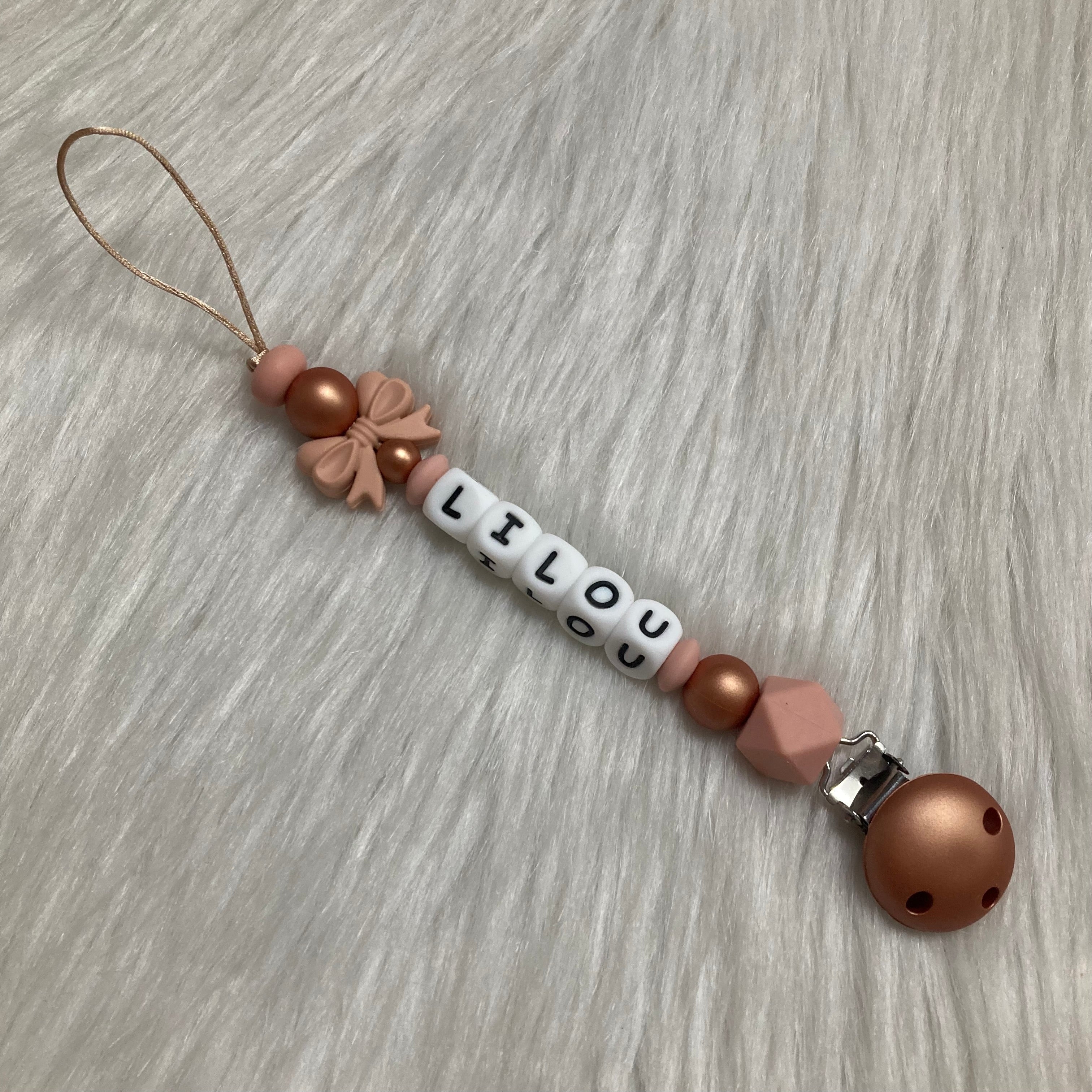 Speenkoord poeder roze strikje roze/koper tinten