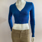 Short cardigan in blue with lace pattern on the back