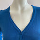 Short cardigan in blue with lace pattern on the back