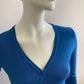 Short cardigan in blue with lace pattern on the back