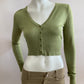 Short cardigan in green with lace pattern on the back