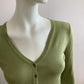 Short cardigan in green with lace pattern on the back