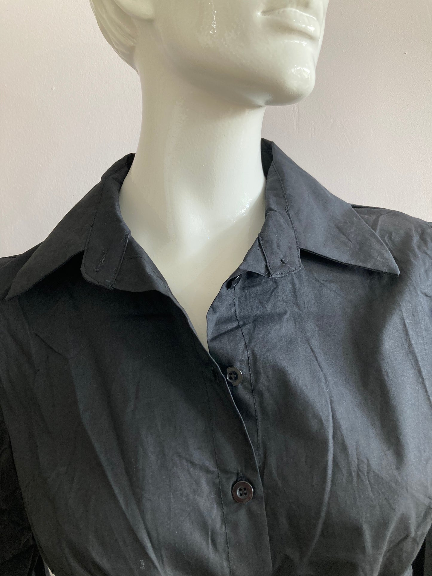 Black shirt with puffed sleeves and integrated belt