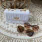 Bag stitching gold and white details