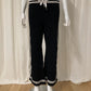 Very flared jogging-style Noir palazzo with bands