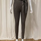 Slim-fit trousers in taupe gingham pattern, fleece inside with pockets and belt